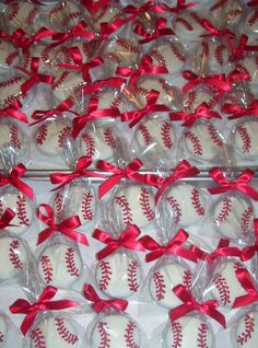 baseballs wrapped in plastic and tied with red ribbon