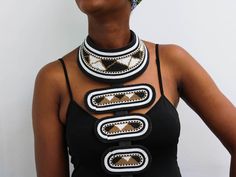 AHERO African leather necklace made using 100% fine beads.

Color: white, black and gold

Closure: hook

Length: 18 inches long

Material: Beads, wire and brass

It is made on order hence it's ready to ship within 1-3 days.

Shipping cost is calculated during checkout.

DHL Express shipping that takes  3-5 days to be delivered Male African Necklace, Gift Bib Necklace With Large Beads, African Beads Necklace, Cloth Jewelry, Big Jewelry, Unique Accessories, Colorful Bags, African Beads, African Jewelry