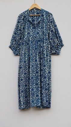 "Feel beautiful throughout your days wearing our block print dress, made from soft cotton gauze. The material drapes so beautifully, Perfect for travel, lunch dates or an effortless dress to pop over your swimmers. Material ~ 100% Cotton gauze. Care ~ Gentle hand wash. Air dry in shade. Made ~ India OUR SIZE GUIDE Please use the following measurements and information as a guide to find the best fit for you so you can flow effortlessly in BABITATEX. MEASUREMENT PREFERENCE Size Chart in Inches:- S Cotton Beach Dress With Gathered Sleeves, Bohemian Maxi Dress In Cotton Voile, Bohemian Maxi Length Cotton Voile Dress, Blue Vacation Dresses With Gathered Sleeves, Blue Dresses With Gathered Sleeves For Vacation, Flowy Cotton Dress With Batik Print, Flowy Cotton Voile Summer Dress, Bohemian Maxi Dress With Gathered Sleeves For Brunch, Bohemian Midi Dress With Gathered Sleeves For Beach