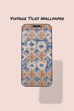 an orange and blue floral pattern on a white background with the words vintage tiles wallpaper