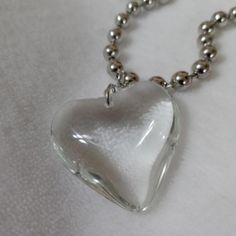 White Transparent Glass Heart Necklace Chunky Chain Trendy Glass Chain Necklace, Everyday Glass Chain Necklaces, Everyday Glass Chain Necklace, White Heart Necklace With Chain, Trendy White Glass Necklaces, Trendy Clear Metal Jewelry, Trendy White Necklace With Heart Charm, Trendy White Glass Necklace, White Metal Heart Necklace With Heart Charm