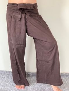 "Unisex Thai fisherman pants. One size fits all. You can wear in many occasions, casual wear, yoga wear, relax at home, travel etc. If you are looking for some pants that you can wear everywhere, comfortable, relax and Easy to wear. Thai fisherman pants is Answer!! Nice gift for yourself or your lover One pocket on the side for storing your items such as wallets, mobile phones, etc Approx. Measurements: One size can fits most and 1 Pockets Waist around 51\" (Wrap Pants) Length 45\" Lower Leg 14\ Comfortable Cotton Wide Leg Pants, Comfortable Cotton Wide Leg Trousers, Beach Cotton Harem Pants In Solid Color, Beach Cotton Harem Pants, Beach Harem Pants In Solid Cotton, Comfortable Wide Leg Cotton Pants, Cotton Yoga Pants With Relaxed Fit, Solid Color Cotton Yoga Pants For Summer, Casual Linen Yoga Pants