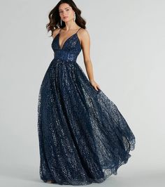 The Stacy ball gown gleams from every angle in a dazzling display of glitter sequins to make your debut at formal dances, banquets, and black-tie weddings! She stuns in a sleeveless plunge V-neckline with a pleated bust, adjustable spaghetti straps that cross along the sultry open-back, and a flattering A-line silhouette with a floor-length hem. The ball gown is composed of a glitter sequined tulle fabric with a tulle and stretchy knit lining for a voluminous effect. Style with a lariat necklace Glitter Bridesmaid Dress, Mom Prom, Quince Planning, Backless Dress Short, Dress Satin Bridesmaid, Short Graduation Dresses, Prom Dress Shoes, Tulle Balls, Beach Wedding Guest Dress