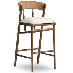 a wooden stool with a white cushion on the seat and backrest, against a white background