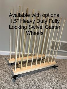 there is a wooden rack with metal rods on it and the words, available with options 1 5 heavy duty fully locking swive caste wheels