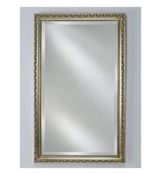 a gold framed mirror hanging on the wall