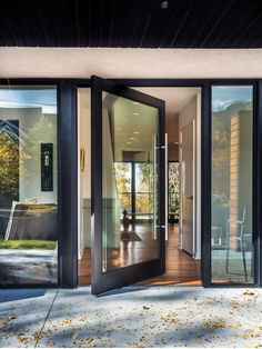 an open glass door leading to a patio