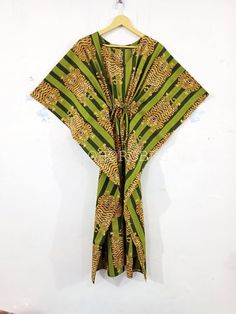 "BohoRobes Animal Printed Cotton Kaftan Dress, Cotton Summer Dress, Boho Maxi Dress, Beach Cover Up, Gifts For Her Size - Free Size Length - 44/ 48/ 52 Inches Bust/chest size - 120 CM/ 48 Inches Fabric - 100% Cotton Pattern - Tiger Print Green Tiger Print Kaftan Dress, Indian Kaftan, Cotton Caftan Dress, Long Dress, Beach Dress, Kaftan For Women, Boho Maxi Dress Kaftan has Adjustable Drawstring Waist to loose or tight , Kaftan has V Shape Neck Which is 8\" Inches Deep. Kaftan Is Multi-purpose an Green V-neck Kaftan For Vacation, Green V-neck Tunic For Beach, Green Bohemian Tunic Kaftan, Bohemian Long Green Kaftan, Green Free Size Festival Kaftan, Long Green Kaftan For Festival, Green Long Kaftan For Festival, Bohemian Green Kaftan With Kimono Sleeves, Green Free Size Bohemian Kaftan