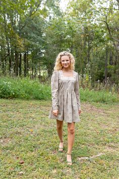 “I like to scrunch up the sleeves,” says Jacklene of styling Modafleur’s Rose Dress. The dusty olive-green mini dress features slightly a more fitted long sleeve with puff shoulder, embroidered square neckline and fitted bodice. The Rose Dress is printed on poplin with a Modafleur exclusive monotone design, an embroidered neckline, and is cut from a tone-on-tone printed poplin fabric. Jacklene pairs Rose with everything from ankle booties to strappy heels to velvet pumps. Details Green Print + e Fitted Mini Dress With Gathered Sleeves For Garden Party, Square Neck Smocked Bodice Mini Dress For Garden Party, Fitted Mini Dress With Smocked Bodice For Fall, Fitted Long Sleeve Mini Dress With Smocked Back, Fall Mini Dress With Smocked Back, Fitted Mini Dress With Smocked Bodice And Long Sleeves, Fall Square Neck Dress With Smocked Back, Fall Mini Dress With Gathered Sleeves, Fall Mini Dress With Gathered Sleeves And Square Neck