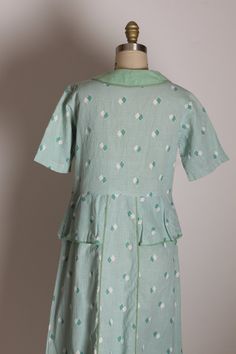 "1930's Mint Green Blue and Cream Short Sleeve Bow Neckline Peplum Waist Diamond Shape Feedsack Dress This dress features: *Mint greenish blue and cream colors *Geometric diamond shape print *Feedsack material *Short sleeved *Pullover *Bow detail on neckline Size: Medium Measurements: Bust: 37\" Waist: 33\" Hip: 42\" Length: 44\" Condition: Excellent. Some small hole fraying below waist line on one side. If you have any questions, please ask! Find even more Vintage Medium-Large at: https://www.e Vintage Green Dress With Pockets, 1950s Green Short-sleeved Dress, 1950s Style Green Short Sleeve Dress, 1950s Green Short Sleeve Dress, 1950s Style Green Daywear Dresses, 1950s Style Green Dresses For Daywear, 1950s Green Dresses For Daywear, Retro Green Vintage Dress For Daywear, Feedsack Dress