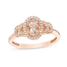 Celebrate your unique love story with this charming gemstone and diamond engagement ring. Crafted in precious 10K gold, this fanciful choice features a 7.0 x 5.0mm soft-pink morganite wrapped in a frame of glistening diamonds. Pairs of leaf-life marquise-shaped frames adorned with shimmering petite diamonds flank the center design in elegant style. Radiant with 1/10 ct. t.w. of diamonds and a bright polished shine, this engagement ring displays all the affection in your heart. Elegant Rose Gold Diamond Ring With Accent Stones, Elegant Morganite Rings With Diamond Accents, Rose Gold Rings With Diamond Accents And Morganite, Exquisite Morganite Diamond Ring For Anniversary, Morganite Diamond Ring With Diamond Accents As Gift, Morganite Diamond Ring With Accents For Gift, 14k Rose Gold Wedding Ring With Center Stone, Morganite Diamond Ring With Diamond Accents For Wedding, 14k Rose Gold Diamond Ring With Halo Setting