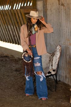 Discover the perfect blend of rugged style and comfort with our Sassy High Waisted Ripped Jeans, uniquely designed for the bold at heart. Embrace your inner cowgirl with this statement piece that's both daring and reliable. Please note, our model is wearing size 3 and we recommend sizing up for the ideal fit. Chic Country Outfits, Modern Western Outfits, Dressy Western Outfits Women, Black Western Outfit, Nfr Vegas, Nfr Outfits, High Waisted Ripped Jeans, Christmas Punch, Western Outfits Women