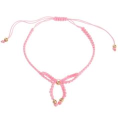 a pink string bracelet with gold beads and two small beads on the end of it