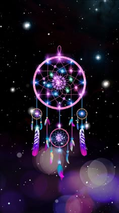 an image of a dream catcher in the night sky with stars and lights on it