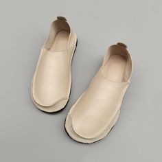 Beige Slip-on Flats With Flat Bottom, Beige Slip-on Flats, Beige Flat Bottom Slip-ons, Beige Flat Slip-ons With Leather Sole, Modern Slip-on Moccasins For Spring, Flat Heel Leather Shoes With Textured Sole, Leather Slip-ons With Leather Footbed, Workwear Faux Leather Slip-ons With Flat Heel, Elegant Everyday Slip-ons With Leather Sole