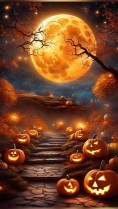 halloween pumpkins are lit up on the steps leading to a full moon in the sky