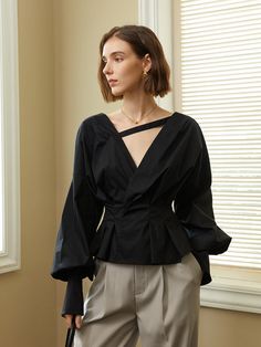 Editor's Notes The blouse has puffed sleeves with buttons at the sleeve ends, addressing an elegant mood. Pair with Knot Belted Tailored Trousers for a chic, stylish fit. - Wrap blouse with a deep V-neckline- Strip of fabric connecting the necklines- Low cut backline- Buttons at the backMeasurements(in.)ONE SIZE - Chest: 34.64 in.- Waist: 27.16 in. - Shoulders: 10.62 in. - Total Length: 21.06 in.Model info: Height 5' 7.5, Size 55Composition & Care- 100% Polyester- Dry clean or light handwashing recommendedDesigner- by yyiam Voluminous Blouse With Blouson Lantern Sleeves, Chic Tops With Voluminous Blouson Sleeves, Chic Tops With Blouson Sleeves, Spring Evening Tops With Elastic Sleeves, Evening Tops With Gathered Balloon Sleeves, Evening Tops With Elastic Sleeves For Spring, Spring Evening Top With Elastic Sleeves, Chic Voluminous Long Sleeve Blouse, Chic Blouse With Voluminous Bishop Sleeves