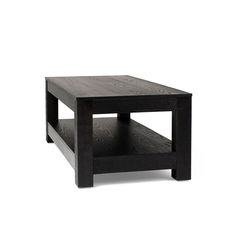 a black coffee table sitting on top of a white floor next to a wooden shelf