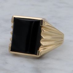 This retro 10k gold chunky ring features a gorgeous rectangle cut onyx signet with a beveled shoulder design.  Measurements - size 10, weighs 6.4 grams, head 16mm wide, base band 4mm  Condition - great vintage condition with light wear Markings - marked as shown Gold Chunky Ring, Chunky Ring, Retro Ring, Chunky Rings, Shoulder Design, Signet Ring, 10k Gold, Rings Statement, Statement Rings