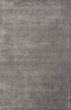 an area rug with grey colors