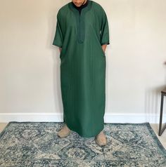 Moroccan Thobes  High quality Moroccan style thobes. Available in various colours and sizes. Message for the perfect size. How to find the perfect size according to your height: 5ft6-5ft8 - Medium 5ft8-5ft10 - Large  5ft10-6ft - XLarge  6ft-6ft2 - XXLarge Once you have placed an order, please message the size you would like and we will send the size you have requested in the thobe. NOTE: There is one pocket on the thobe and one open pocket. Long Thobe For Eid, Green Long Thobe For Eid, Green Dabka Thobe For Eid, Fitted Long Thobe For Eid, Casual Long Thobe For Eid, Solid Long Thobe For Eid, Traditional Green Long Thobe, Bohemian Thobe For Festival, Maxi Length, Traditional Green Floor-length Thobe