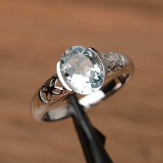 It is a natural aquamarine ring. The main stone is 7mm*9mm oval cut, weight about 1.58 carats.The basic metal is sterling silver and plated with rhodium.To change the metal to a solid gold (white/rose) or platinum is also available, please ask for a quotation if you want.You can also go to my shop Home for more elegant rings: https://www.etsy.com/shop/godjewelry?ref=hdr_shop_menuMore rings:https://www.etsy.com/shop/godjewelry?ref=l2-shop-header-avatarCustomization is always welcome and please fe Luxury Gold Birthstone Ring With Bezel Setting, Luxury Bezel Setting Birthstone Ring, Silver Aquamarine Birthstone Ring, Oval Shape, Silver Aquamarine Oval Birthstone Ring, Silver Aquamarine Birthstone Ring, Oval Cut, Silver Oval Aquamarine Birthstone Ring, Aquamarine Topaz Ring With Bezel Setting, Oval Aquamarine Topaz Ring With Bezel Setting, Bezel Setting Ring