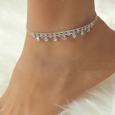 ✦ Add some sparkle to your summer look with our Dainty Rhinestone Silver Anklet Chain. This beautiful ankle bracelet features a delicate silver chain adorned with sparkling rhinestones, giving you a simple yet elegant look. Perfect for any occasion, this satellite anklet is both glamorous and versatile, making it a great addition to your summer jewelry collection. Crafted with high-quality materials, this anklet is both durable and stylish. Whether you're wearing sandals or flip-flops, this dain Elegant Alloy Anklets For Summer, Adjustable Alloy Summer Anklets, Summer Adjustable Alloy Anklets, Elegant Summer Alloy Anklets, Silver Alloy Bracelets With Rhinestones, Silver Rhinestone Bracelets In Alloy, Silver Rhinestone Alloy Bracelets, Silver Alloy Anklet As Gift, Adjustable Alloy Anklets For Party