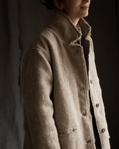 Undyed men's heavy coat SIBERIA The SIBERIA coat is made of heavy weight material -- composition of 100% natural hemp and wool, thick and warm, with alive visible texture. Lining is made of 100% natural heavy weight linen. Color is natural grey with a warm tone. The coat has two pockets, natural palm tree buttons, hand stitched details along shoulder seam, pockets and buttonholes. All the hems of the coat are unfinished. The SIBERIA coat can be made in two versions -- with or without insulation. Iceland Mens Fashion, Alpaca Coat, Boho Coat, Boho Men, Blazer Jackets For Women, Concept Clothing, Beige Coat, Heavy Coat, Warm Tone