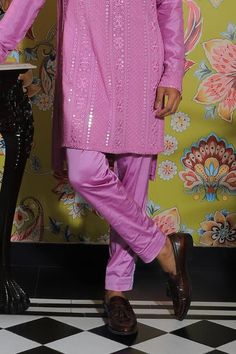 Flamingo pink kurta with mirror embroidery all over. Paired with a trouser.
Components: 2
Pattern: Embroidered
Type Of Work: Mirror
Neckline: Band collar
Sleeve Type: Long
Fabric: Silk, Stretch Cotton
Color: Pink
Occasion: Mehendi and Puja - Aza Fashions Pink Sherwani With Mirror Work For Designer Wear, Bollywood Style Pink Sherwani With Mirror Work, Pink Bollywood Sherwani With Mirror Work, Pink Chanderi Sherwani With Resham Embroidery, Festive Pink Kurta With Mirror Work, Bollywood Style Kurta With Mirror Work For Spring, Pink Mirror Work Sherwani For Festivals, Pink Sherwani With Mirror Work For Festivals, Traditional Mirror Work Kurta For Spring