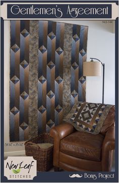 a brown leather chair sitting in front of a wall with a decorative design on it