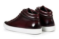 Sneaker heads rejoice. Our mid-top sneaker is made from the finest Italian calfskin leather with extra padding for exceptional comfort. Runs true to size. For example, if you normally wear a size 10 sneaker, order a size 10 Full-grain Italian calfskin leather Black interior leather lining Painted by hand Handmade in Italy