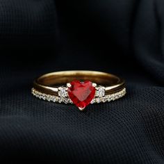 Product Details Be the center of attention with these delightful Heart Ring Set. It featured with Heart Shape Created Ruby in Prong Setting and Round Shape Diamond. This Solitaire Enhancer Ring Set is beautifully composed in Solid Gold. The solitaire ring set is perfect for special occasions such as Valentines Day, anniversary, or a gift for a loved one. The Created Ruby ring is a great way to add a touch of luxury to your everyday look. The combination of Created Ruby and Diamond stones gives it a touch of elegance and uniqueness. Product Information SKU SHP-RINGS082226111 Weight 3.04 gm (Approximate) LAB CREATED RUBY INFORMATION No.of Stones 1 Pieces Total Weight 0.90 Carat (Approximate) Dimension(approx) Heart-6X6 mm-1 Pcs Color Red Cut Brilliant Shape Heart Setting Type Prong-Setting Q Heart-shaped Yellow Gold Diamond Ring With Center Stone, Red Diamond Heart Ring For Anniversary, Red Heart Diamond Ring For Anniversary, Red Heart Shaped Diamond Anniversary Ring, Gold Heart Ring With Center Stone For Valentine's Day, Heart-shaped Diamond Ring For Anniversary, Valentine's Day Yellow Gold Brilliant Cut Wedding Ring, Valentine's Day Yellow Gold Wedding Ring With Brilliant Cut, Valentine's Day Ruby Yellow Gold Ring