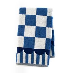 a blue and white checkered towel with scalloped edges