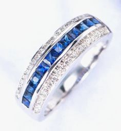 9ct White Gold Three Row Diamond & Blue Sapphire Ring 0.21ct Diamond Weight : 0.21ct Metal : 9ct (375) Gold Weight : 3.2 grams  Hallmarked : Yes, London Assay Office Finger Size : P Packaging : Elegant Box  Shipping Free in UK Shipping World Wide : See Policy Payment : PayPal, Credit Card, Bank Transfer You are welcome to visit our north West London Showroom to view this item. Blue Sapphire Wedding Band, Diamonds Wedding Band, Birthstone Band, Family Ring, Ceylon Blue Sapphire, Hari Valentine, Sapphire Wedding Band, Sapphire Engagement Ring Blue, Gem Ring