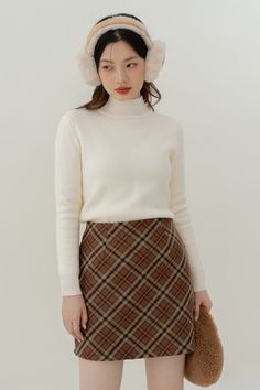 Faux wool tweed mini skirt in a bold diamond check pattern. Concealed back zipper. Lined with safety shorts. S: 25" waist, 33" hips, 16" lengthM: 26.5" waist, 34.5" hips, 16" lengthL: 28" waist, 36" hips, 16" lengthXL: 29.5" waist, 37.5" hips, 16" length Fitted Plaid Skort For Winter, Plaid Mini Skirt For Winter Workwear, Winter Workwear Plaid Mini Skirt, Wool Mini Skirt For Winter, Winter Wool Mini Skirt, Classic Fitted Mini Skirt For Winter, Fitted Classic Mini Skirt For Winter, Safety Shorts, Tweed Mini Skirt