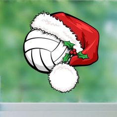 a santa hat on top of a volleyball ball