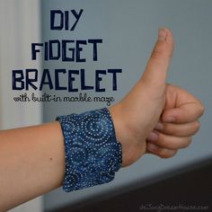 a woman's arm with a bracelet on it and the words diy fidget bracelet