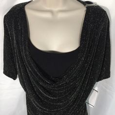 Gorgeous Sexy Holiday Shimmering Metallic Spandex Pullover Top Black Ladies S. (Measurements Below). Scoop Loose Style Neckline Short Sleeves Brand: Connected Apparel Ladies Size Small. From High Value Department Store Originally $60.00 Stretch Material With A Waist Fitted Curve Look, Sexy Fit. Material Nylon, Spandex, And Metallic See Pictures For Details. Light Weight, Can Be Almost Sheer Overlay Black Under Short Top Attached To Overlay. Under Top Is Not Full Length Just Under Breast Area Mea Ladies Shirt, Sheer Overlay, Loose Style, Curves Workout, Department Store, Short Tops, Black Silver, Scoop Neck, Black Women