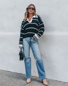 Stay warm and stylish this fall season with our Black and White Stripe Collared Sweater! This long-sleeved sweater features a collared v-neckline and ribbed detailing for a classic look. Made with a comfortable sweater material, the striped pattern adds a touch of sophistication. Simply style it with jeans, ankle booties, and a black clutch for a chic everyday outfit! Trendy V-neck Sweater For Fall Workwear, Casual Knit V-neck Sweater For Work, Casual V-neck Sweater With Ribbed Collar For Fall, Chic V-neck Sweater With Ribbed Cuffs For Fall, Casual Knit V-neck Sweater With Ribbed Collar, Trendy V-neck Sweater For Work, Trendy V-neck Polo Sweater For Winter, Knit V-neck Polo Sweater With Ribbed Collar, Chic Fall Sweater With Striped Collar