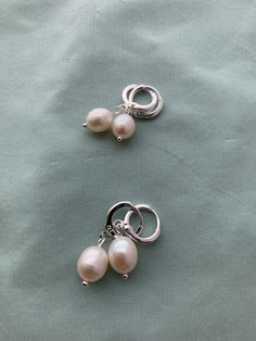 "Creamy light creamy white, natural 1) Very Small or 2) Small teardrop oval real pearls and mounted on lovely period appropriate loops in 16k gold or silver plated brass loops: great soft close, stay on well and great for sensitive ears (lead free, nickel free). These small real pearl earrings were inspired by the pair that British royalty wear on a regular basis! THIS LISTING is a CUSTOMER FAVORITE! MEASUREMENTS: Earrings measure about 1\" long VERY SMALL: 7.2 X 8.3mm pearl SMALL: 7.8 X 10.3mm Hypoallergenic Pearl Teardrop Hoop Earrings, Hypoallergenic Teardrop Pearl Hoop Earrings, Pearl White Clip-on Earrings With Pearl Drop For Gift, Silver Teardrop Hoop Earrings With Pearl Charm, Cream Pearl Drop Jewelry, Teardrop Hoop Earrings With Pearl Pendant, Teardrop Hoop Earrings With Pearl Pendant As Gift, Silver Teardrop Pearl Hoop Earrings, Silver Hoop Earrings With Pearl Drop