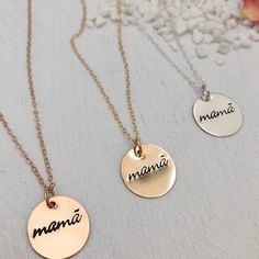 A minimalist lover's modern token of motherhood. A beautiful piece to celebrate your mama status. Mamã with the accent on the a is an ode to the designers Portuguese heritage. We love this piece to layer with other necklaces. Pendant measures 5/8 inch. Available in sterling silver, 14kt gold or rose gold fill made to last and be worn everyday. Fancy Font. This piece is ready to ship and usually leaves our studio in 1 to 3 business days. BACK TO MY SHOP: https://www.etsy.com/shop/IsabelleGraceJew Modern Rose Gold Necklaces As Gift, Modern Rose Gold Necklaces For Gifts, Modern Rose Gold Necklace As Gift, Modern Rose Gold Necklace For Gifts, Modern Rose Gold Necklace Gift, Nickel-free Necklace For Mother's Day Personalized Gift, Adjustable Hand Stamped Necklace, Rose Gold Sterling Silver Necklace For Mom, Hand Stamped Necklaces For Mother's Day