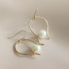 freshwater pearl hoop earrings Everyday 14k Gold Hoop Earrings With Pearl Charm, Classic Adjustable Gold Pearl Earrings, Gold Wire Wrapped Pearl Hoop Earrings, Everyday Gold Wire Wrapped Pearl Earrings, Gold Hoop Pearl Earrings Nickel Free, Delicate Gold Hoop Earrings With Pearl Charm, Everyday Gold Hoop Earrings With Pearls, Everyday Gold Pearl Hoop Earrings, Adjustable Hoop Earrings With Pearl Charm As Gift