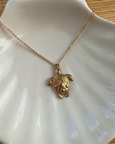 18kt gold plated necklace with a turtle charm. It is long lasted plated and 18kt gold plated. Necklace is 44.5cm in length. Turtle charm is 23.5x18x3mm, Hole: 3mm. Matching bracelet and earrings also available on our shop! We recommend that you do not shower, exercise or expose them to chemicals such as perfumes as this can effect the shine and colour. All orders include free gift wrapping, meaning these are perfect as a gift to yourself or to friends and family 💝  Our tissue paper, postal boxe Gold Turtle Necklace, My Wishlist Ideas, Turtle Gift Ideas, Cute Gold Necklace, Shower Exercise, Sea Inspired Jewelry, Minimalist Necklace Silver, Gifts For Best Friends, Surf Jewelry