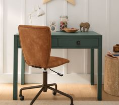 an office chair sits in front of a desk with a star on top of it