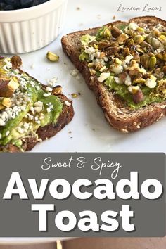 two pieces of toast with avocado and nuts on top, next to a bowl of blueberries