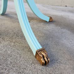 a pair of blue hoses laying on the ground