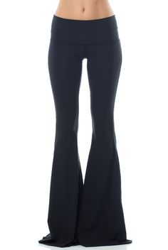 With a classic hue the Teeki Solid Black Bell Bottom will be your new go-to. This Teeki bell bottom offers an all new length 3 inches longer than the original style, allowing you to cut them to your perfect length! A chic Black hue makes the Teeki Bell Bottoms easy to wear and easy to pair with practically anything! Made of a soft recycled water bottle fabric, with breathability, and 4-way stretch, this pant ensures freedom of movement with minimal impact on the earth. With a Black Flare Loungewear Pants, Black Flare Bottoms For Loungewear, Flare Yoga Pants For Fall, Fall Loungewear Flare Yoga Pants, Black Stretch Flares For Fall, Black Stretch Flares With Flared Hem, Casual Black Flares For Night Out, Black Stretch Flares Casual Style, Flare Yoga Pants For Fall Loungewear