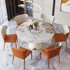 a marble dining table with six chairs around it