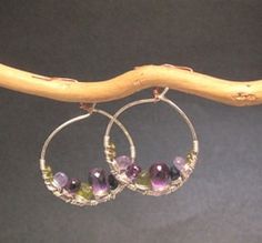 Hammered hoops with amethyst, topaz, tanzanite, peridot Cleopatra 89 Peridot Jewelry With Gemstone Accents, Purple Fusion Style Round Jewelry, Handmade Green Amethyst Gemstones, Adjustable Green Amethyst Jewelry, Purple Multi-stone Bohemian Jewelry, Fusion Style Multi-stone Amethyst Jewelry, Fusion Multi-stone Amethyst Jewelry, Fusion Style Amethyst Multi-stone Jewelry, Purple Bohemian Multi-stone Jewelry