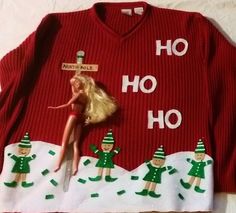 a red sweater with green elfs on it and the words ho ho ho written in white